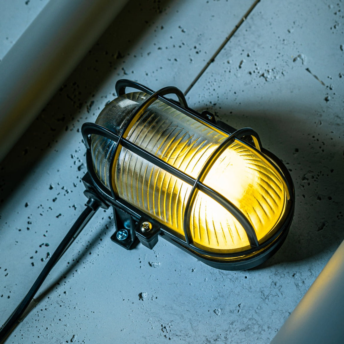 Our industrial style caged outdoor cage light is made from a high-quality polycarbonate body which is weather and rust proof and is complete with a prismatic glass diffuser and protective cage.