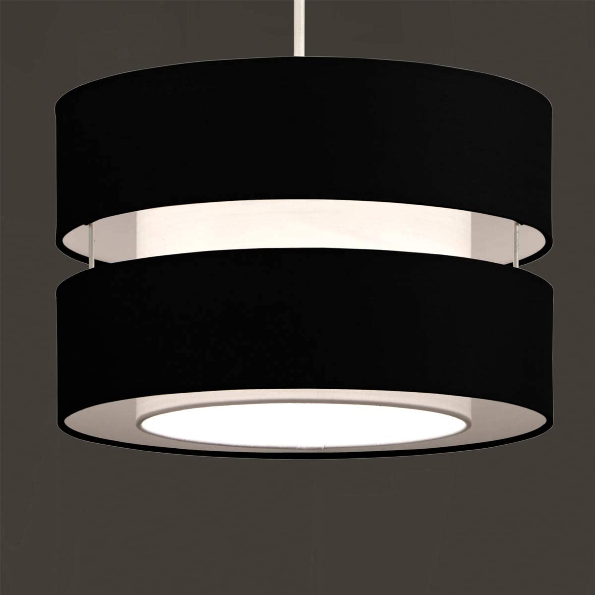 Our Gayle two tiered luxury fabric double layered shade is contemporary in its appearance and we have designed the shade to suit a range of interiors. Easy to fit simply attached to an existing pendant flitting.  It is crafted from high quality fabric material in two layers and complimented with a white inner which looks beautiful when light shines through. The shade has been made to fit both a ceiling light or lamp base.