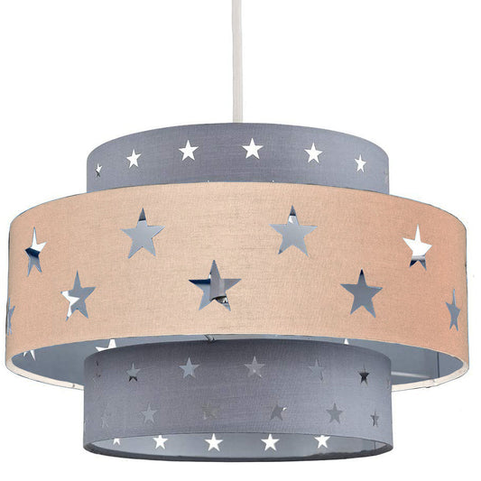 Our Grey and Cream two tiered star shade features a mixture of large and small sweet stars cut out across a grey and cream background. When your lamp is turned on it will shine out through these cut-outs, mimicking a beautiful night sky. This lampshade is made with soft-touch fabric for a little bit of luxury.