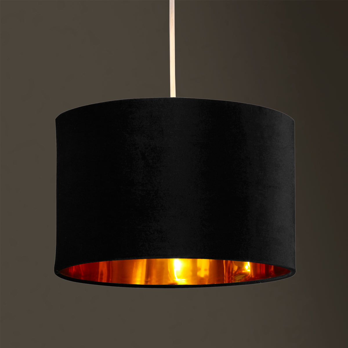 Our Nila velvet shade is sophisticated in appearance and we have designed the shade to  suit a range of interiors. Easy to fit, it’s crafted from high-quality velvet on the outer and has a reflective gold metallic inner. It's made to fit both a ceiling light or lamp base.