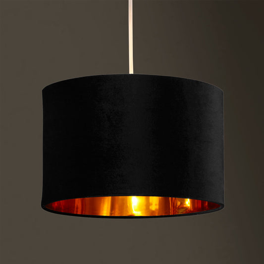 Our Nila velvet shade is sophisticated in appearance and we have designed the shade to  suit a range of interiors. Easy to fit, it’s crafted from high-quality velvet on the outer and has a reflective gold metallic inner. It's made to fit both a ceiling light or lamp base.