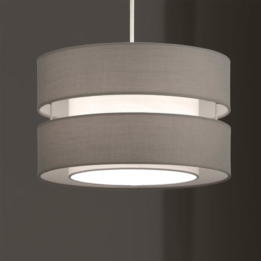 Our Gayle two tiered luxury fabric double layered shade is contemporary in its appearance and we have designed the shade to suit a range of interiors. Easy to fit simply attached to an existing pendant flitting.  It is crafted from high quality fabric material in two layers and complimented with a white inner which looks beautiful when light shines through. The shade has been made to fit both a ceiling light or lamp base.